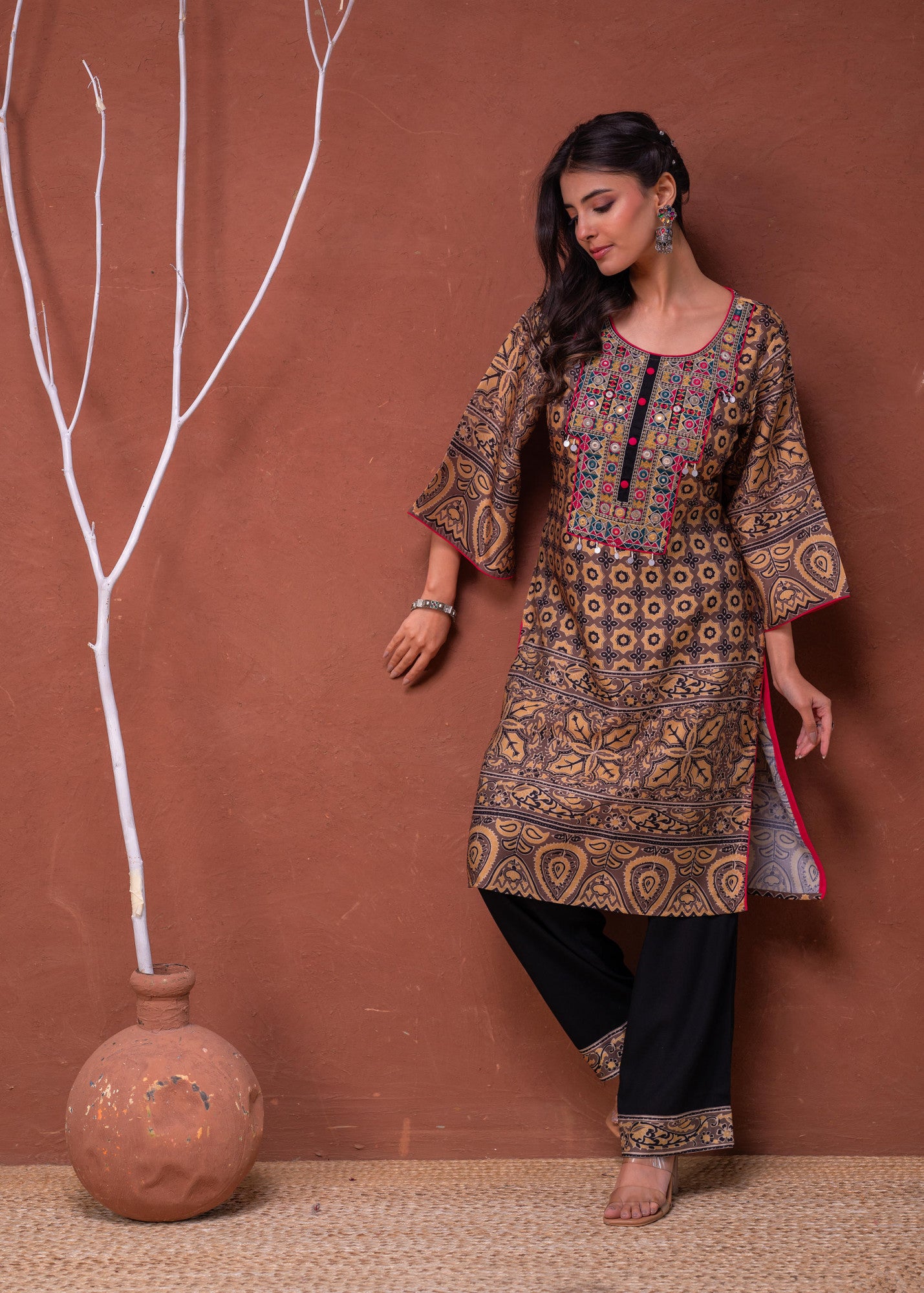 Juniper model wearing mustard embroidered kurta pant set with floral motifs and contrast black pants