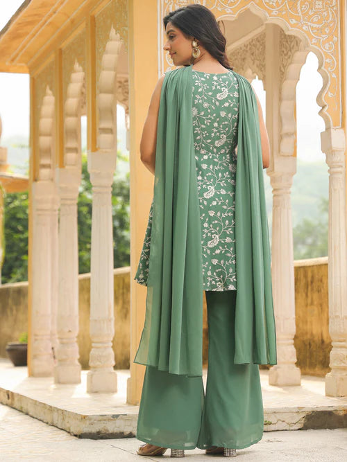 Plumvera sage green georgette kurta set back view on model with printed kurta wide palazzo pants and flowing dupatta