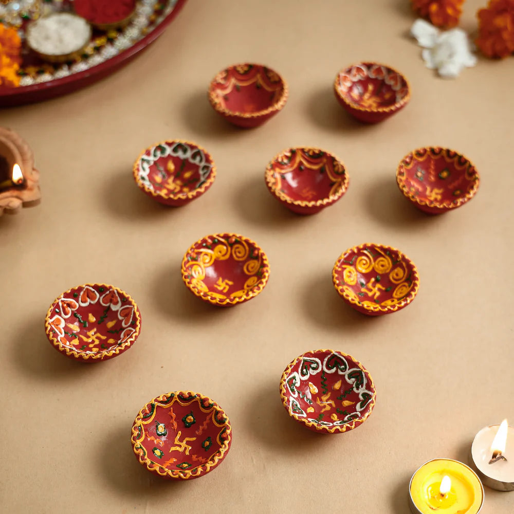 Handpainted clay diyas set of 10 for Diwali decoration.
Eco-friendly terracotta diya lamps handcrafted in India.
Festive clay diyas for home décor and puja rituals
