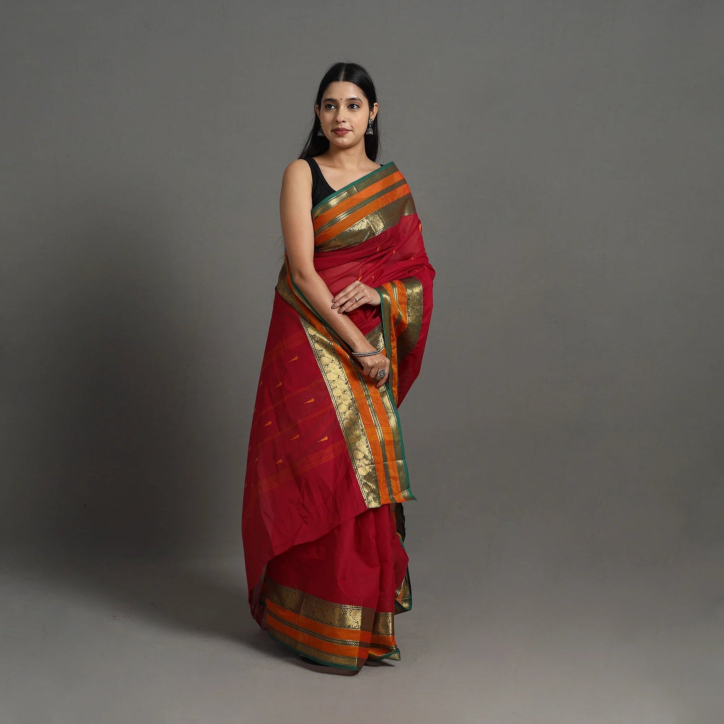 Handmade Red Kanchipuram Cotton Saree with Buti & Zari Border – A Masterpiece from Tamil Nadu’s Temple Town