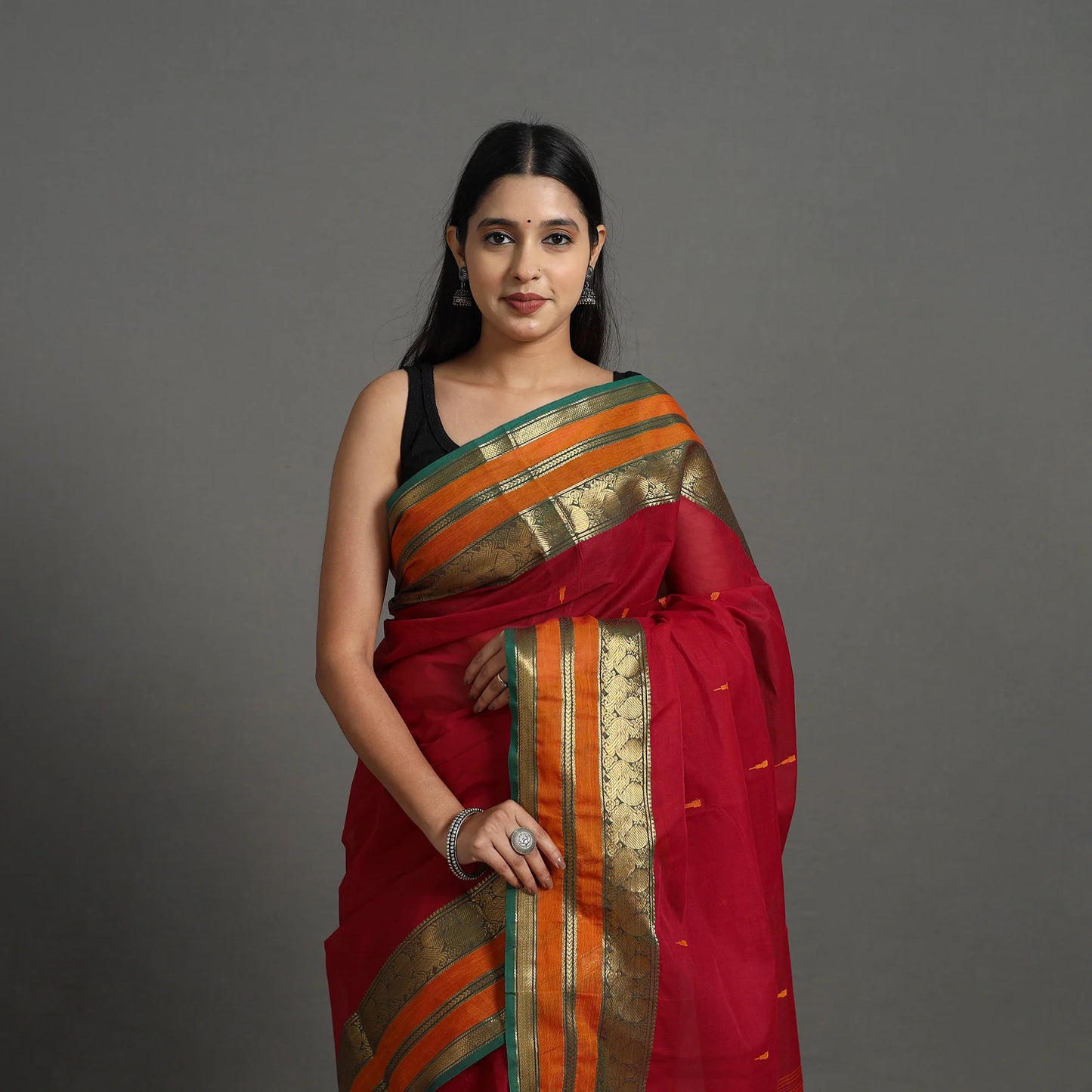 Handmade Red Kanchipuram Cotton Saree with Buti & Zari Border – A Masterpiece from Tamil Nadu’s Temple Town