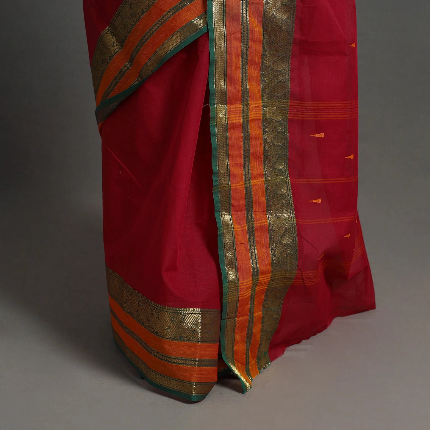 Handmade Red Kanchipuram Cotton Saree with Buti & Zari Border – A Masterpiece from Tamil Nadu’s Temple Town