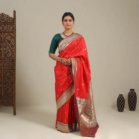 Plumvera model wearing red pure silk paithani saree with green blouse and gold zari border and traditional motifs