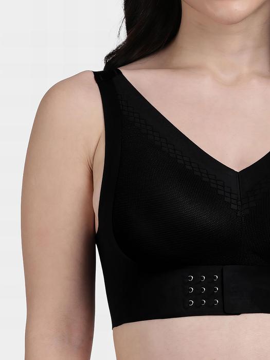 Shyaway black front hook seamless bra on model with V neck wide straps and supportive smooth fabric