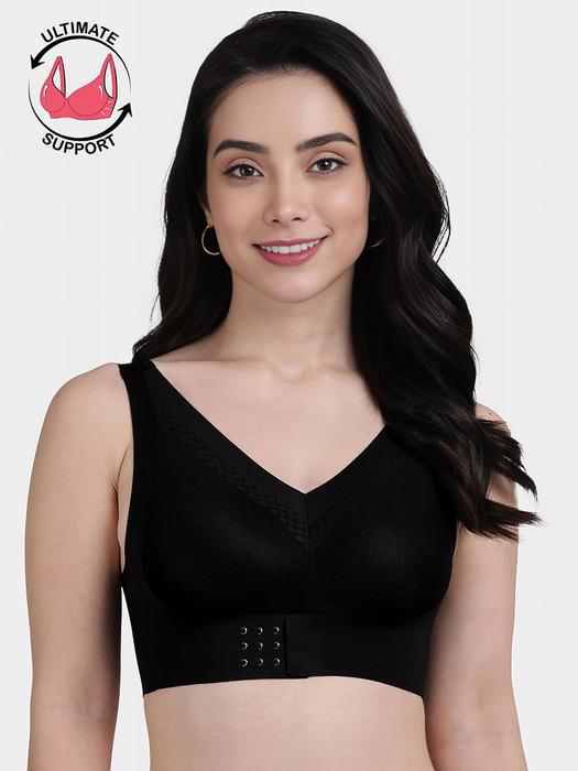 Shyaway model wearing a black front hook seamless bra with wide straps V neck and firm support