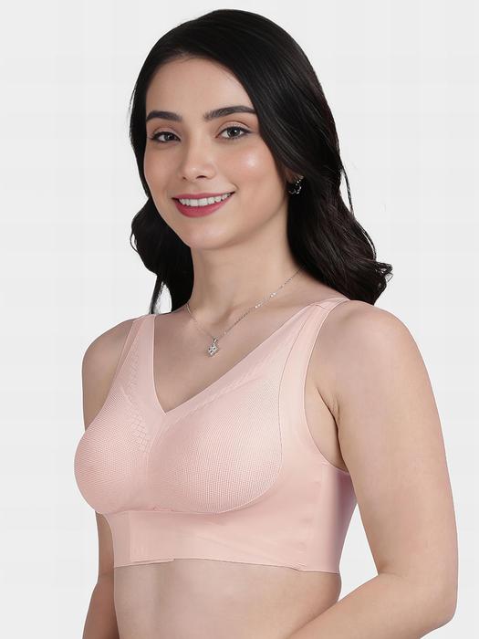 Plumvera peach front hook seamless bra on model showing V neck wide straps and smooth wireless everyday support