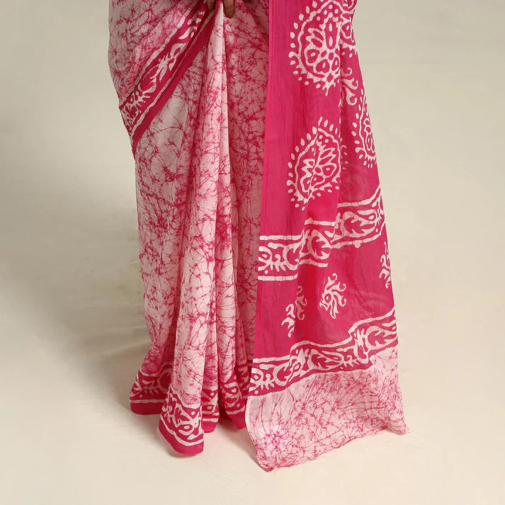 Plumvera pink batik cotton saree draped on model showing pink and white batik patterns and border