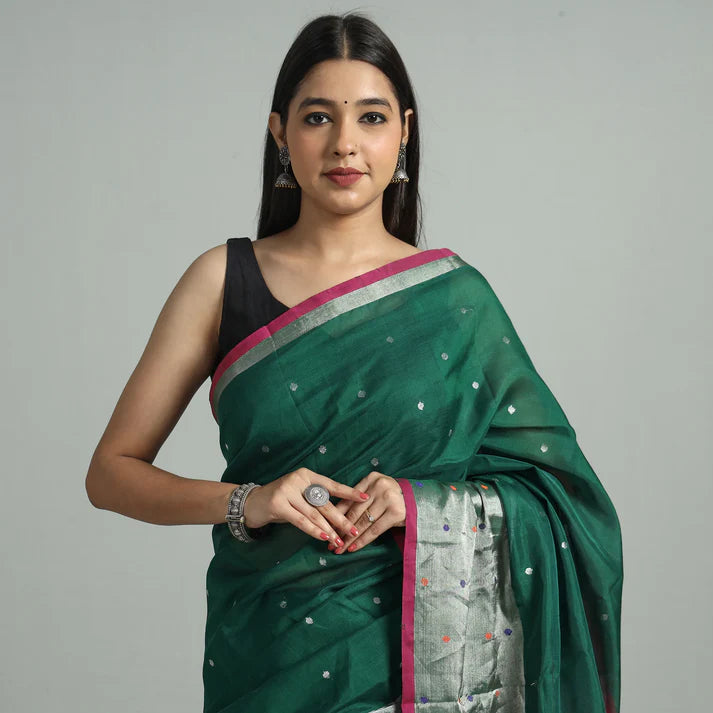 Plumvera model wearing green Venkatagiri silk cotton saree with silver woven border and pink edge