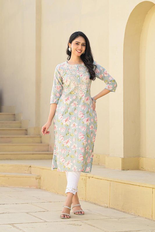 Juniper model wearing green floral cotton kurta with three quarter sleeves embroidered yoke and white leggings